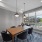 Private conference room with table, chairs, and views of courtyard