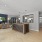 Resident lounge at Riverside Wilton Apartments in Wilton, CT, featuring a front desk and a coffee station.