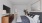 Furnished bedroom with hallway leading to bathroom and closet