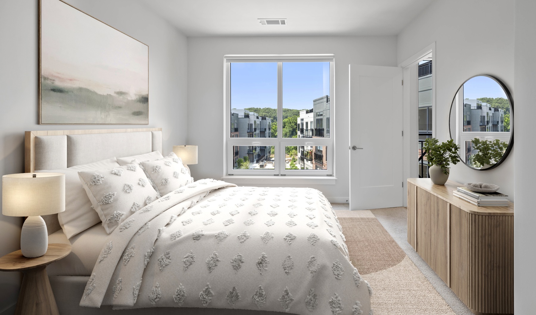 Luxury Wilton, Connecticut Apartments with Top Floor Lofts Staged bedroom with neutral accents,  sunlit windows, and carpet flooring