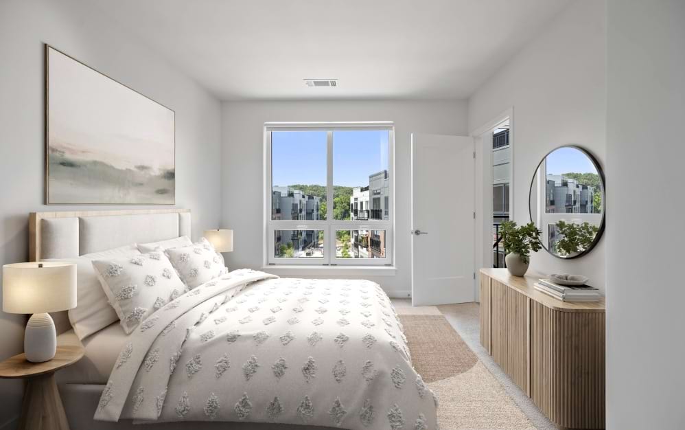 Spacious bedroom in a Wilton CT spacious apartment featuring large windows and neutral interior accents