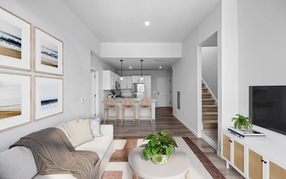 Open-concept living room in a Wilton CT spacious apartment featuring floor-to-ceiling glass windows and natural light