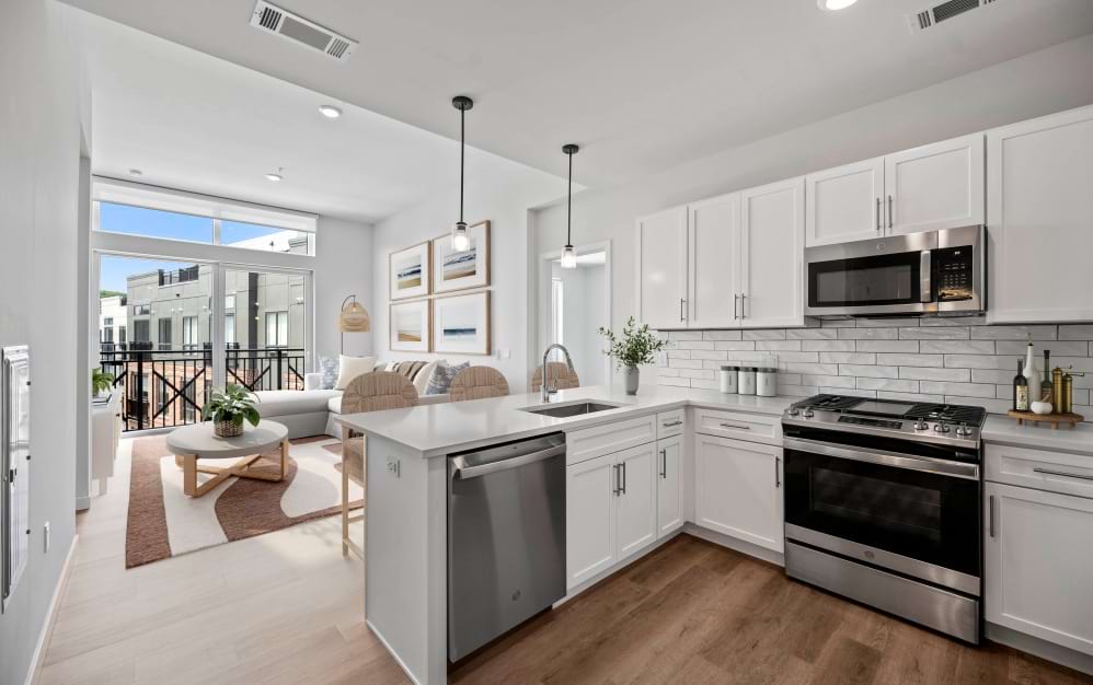 Gourmet kitchen in a Wilton CT spacious apartment featuring center island seating and modern appliances
